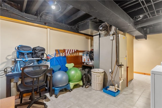 unfinished basement featuring washer / dryer