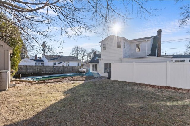 view of yard featuring a fenced backyard and a fenced in pool