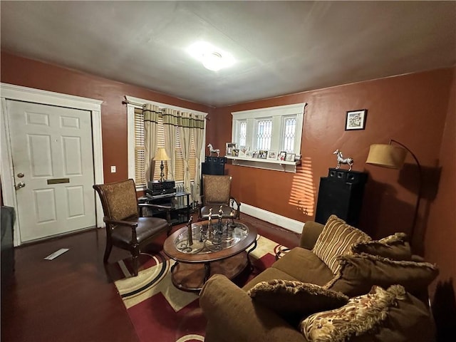 living area featuring baseboards