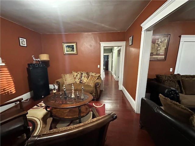 living room with wood finished floors and baseboards