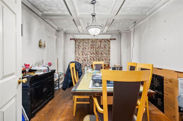 dining room with beam ceiling, ornamental molding, coffered ceiling, and wood finished floors