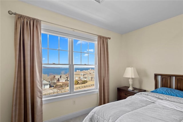 bedroom featuring baseboards