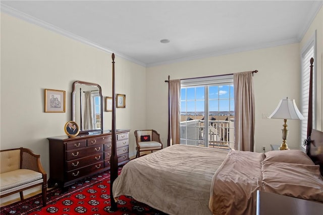 bedroom featuring access to exterior, multiple windows, and crown molding