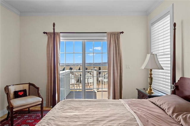 bedroom with access to exterior, multiple windows, crown molding, and baseboards