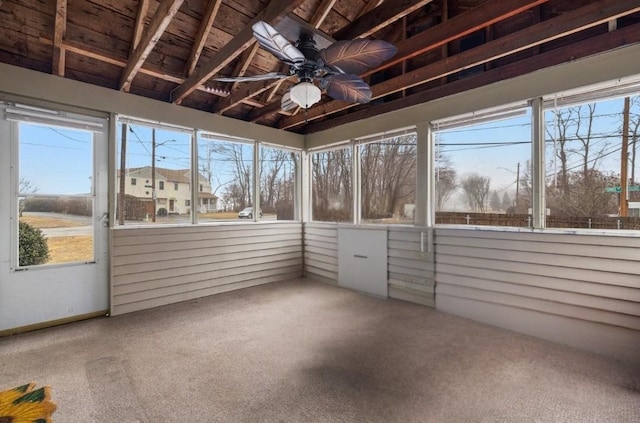 unfurnished sunroom with a ceiling fan