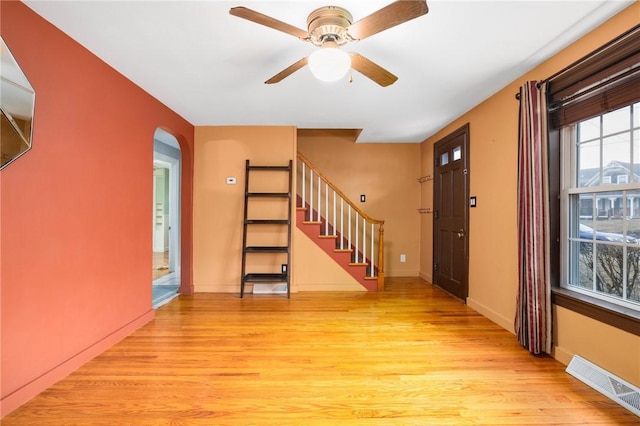 interior space with visible vents, baseboards, stairs, and light wood finished floors