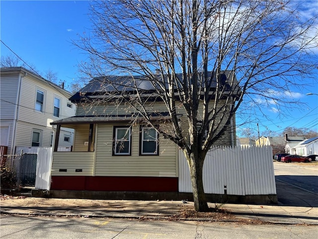 view of side of home with fence