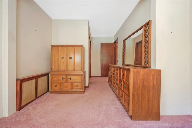 hallway with light colored carpet