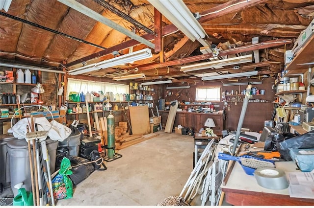 interior space featuring concrete flooring and a workshop area