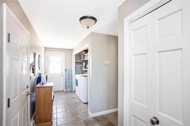 kitchen with washer and dryer and baseboards