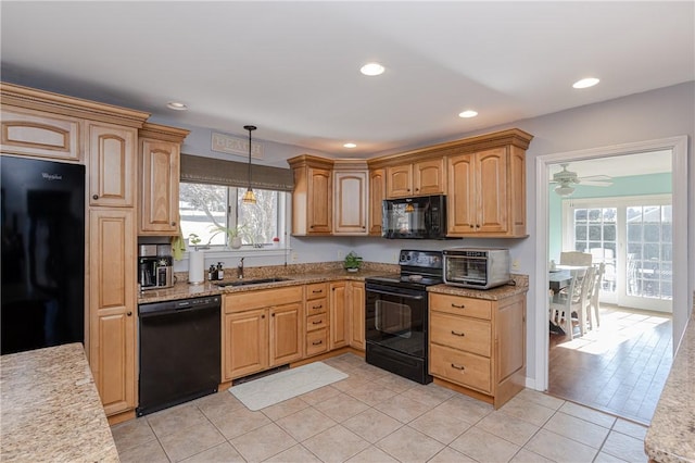 kitchen featuring pendant lighting, light tile patterned floors, recessed lighting, a sink, and black appliances