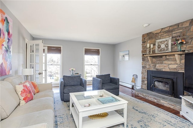 living area with a fireplace and wood finished floors