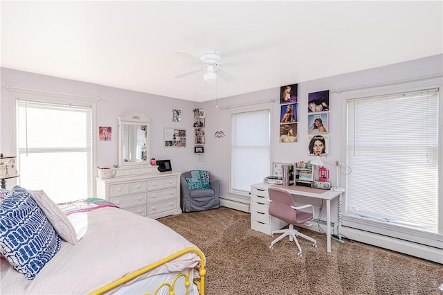 carpeted bedroom with a baseboard radiator and a ceiling fan