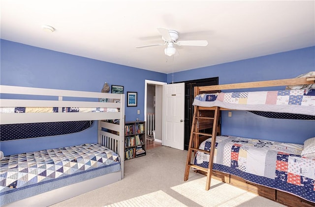 bedroom featuring ceiling fan and carpet floors