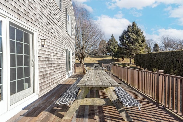 wooden deck featuring outdoor dining space