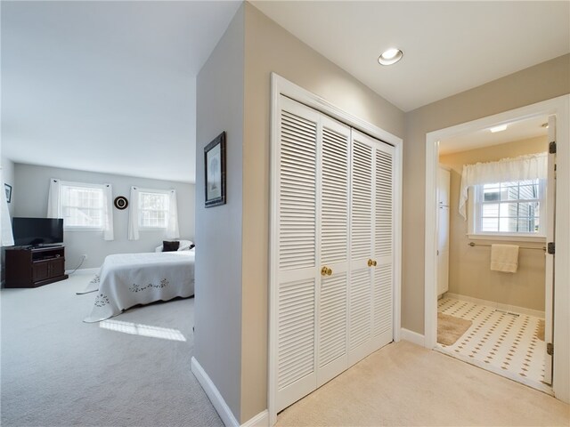 interior space with carpet and baseboards