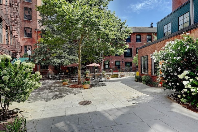 view of property's community with a patio