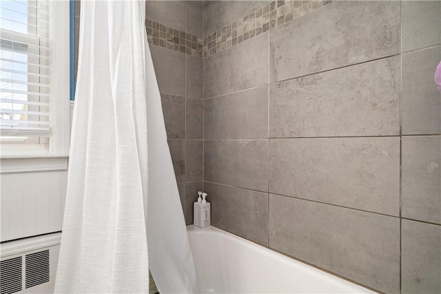 full bathroom featuring shower / bath combination with curtain