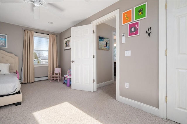 carpeted bedroom with lofted ceiling, baseboards, ceiling fan, and baseboard heating