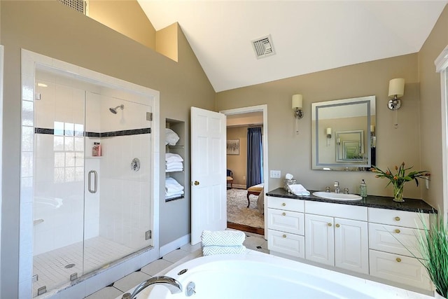 bathroom with a washtub, vanity, visible vents, vaulted ceiling, and a shower stall