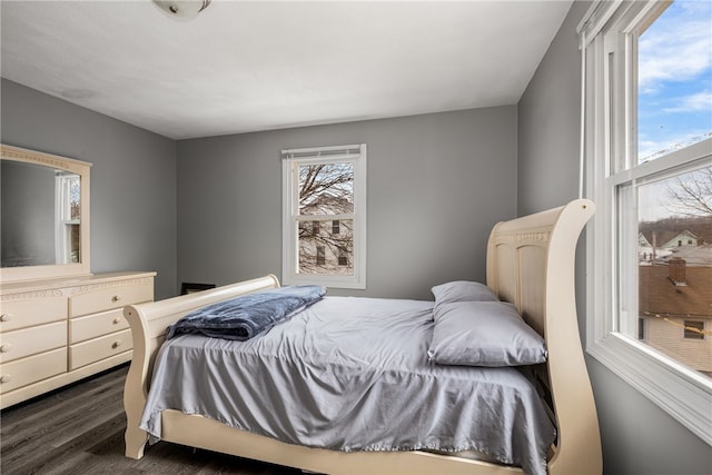 bedroom with dark wood-style floors