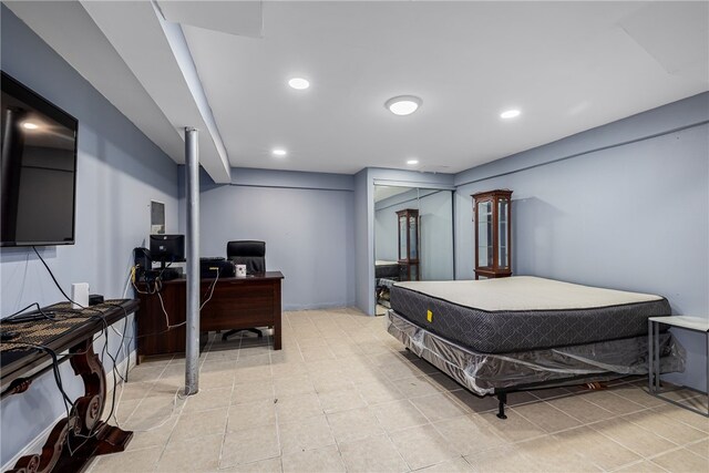 bedroom featuring light tile patterned flooring and recessed lighting