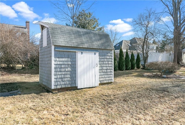 view of shed with fence