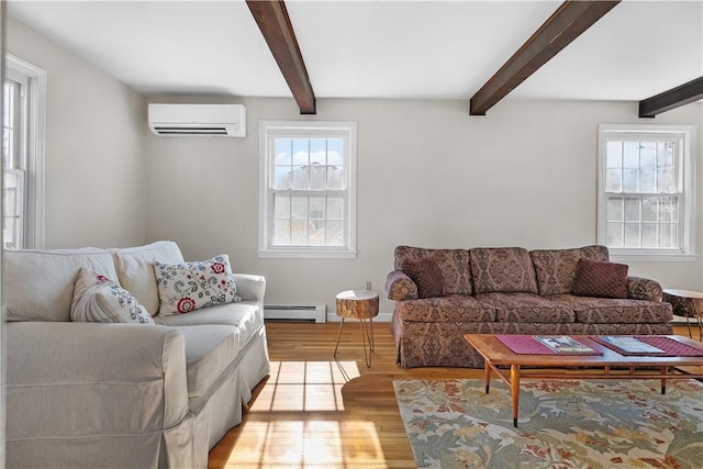 living area with light wood-type flooring, baseboard heating, a wall mounted air conditioner, and beam ceiling