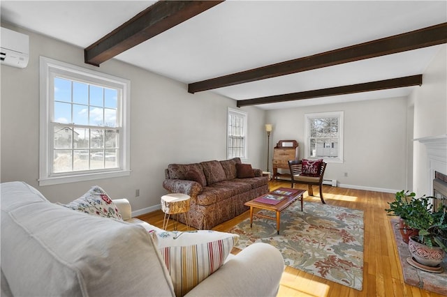 living area featuring a fireplace, wood finished floors, baseboards, an AC wall unit, and beam ceiling