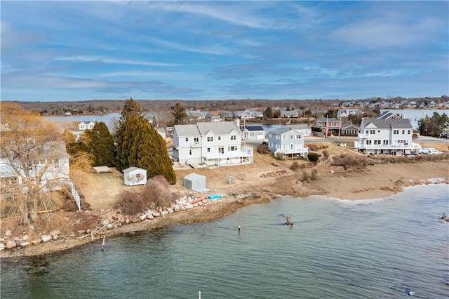 bird's eye view with a water view and a residential view