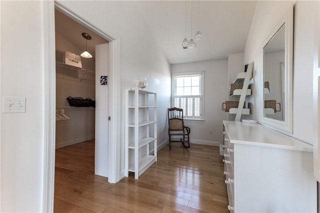 interior space with light wood-style flooring and baseboards