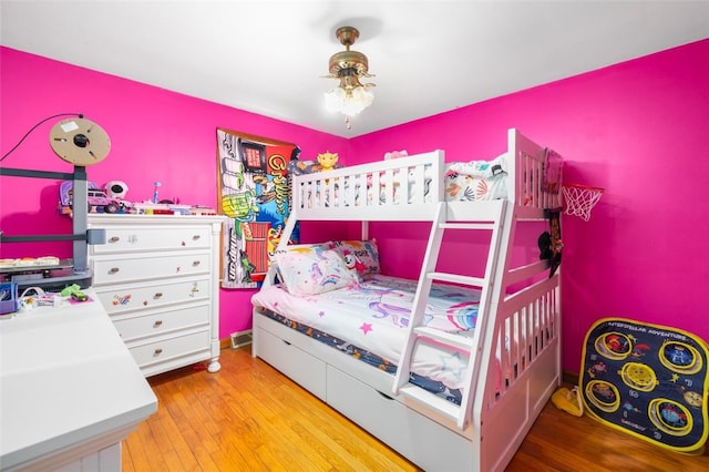 bedroom with wood finished floors