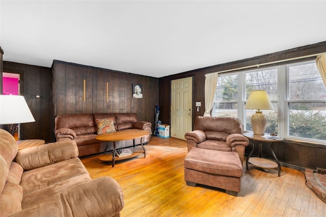 living room featuring wood walls and hardwood / wood-style flooring