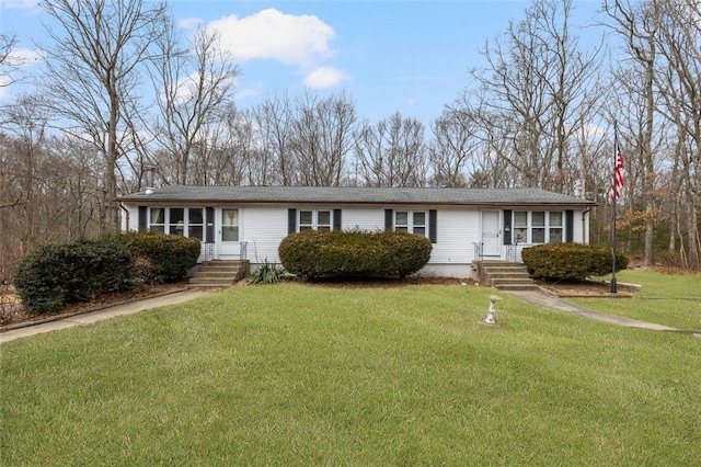 ranch-style home with a front lawn