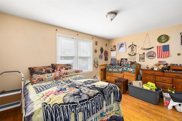 bedroom with light wood finished floors