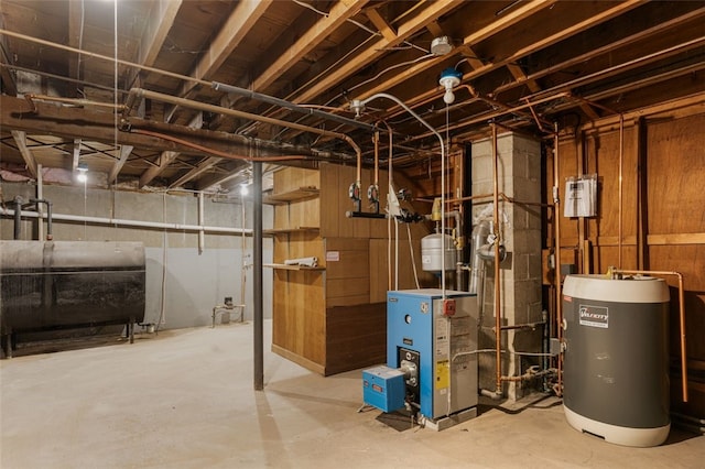 utility room with heating fuel, a heating unit, and electric water heater