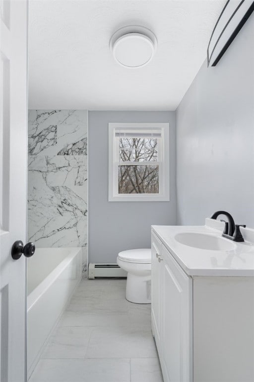 bathroom featuring a baseboard radiator, vanity, and toilet