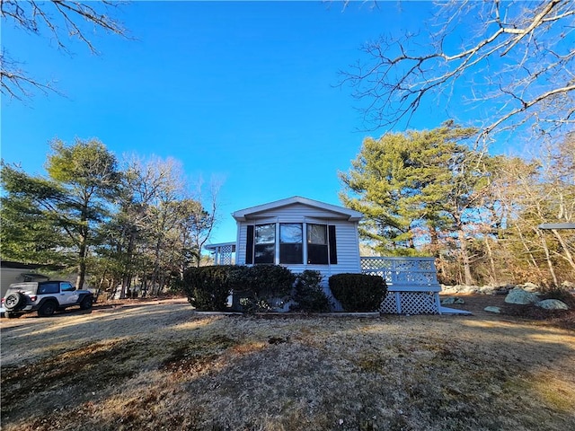 view of front of home with a wooden deck