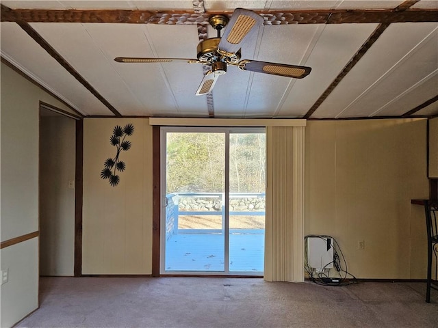 unfurnished room with light carpet, vaulted ceiling, and ceiling fan