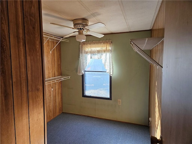 spacious closet featuring carpet floors and a ceiling fan