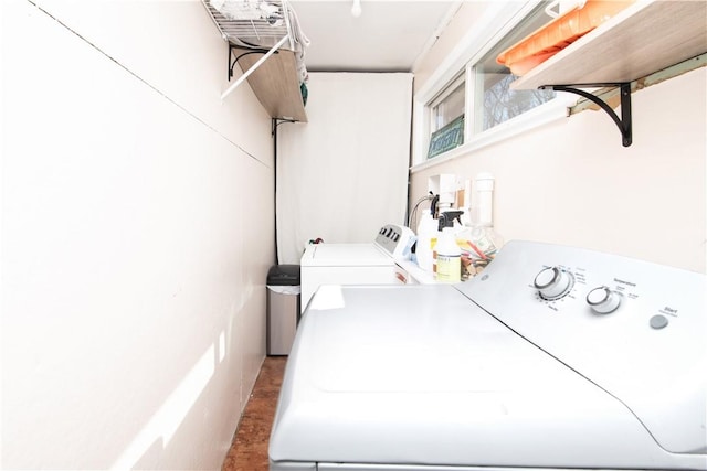 laundry area featuring washer and dryer and laundry area