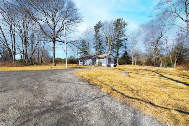 exterior space with gravel driveway