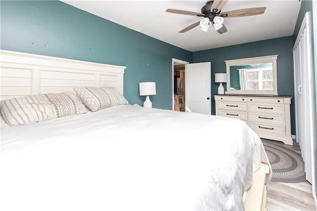 bedroom featuring ceiling fan and light wood-style floors