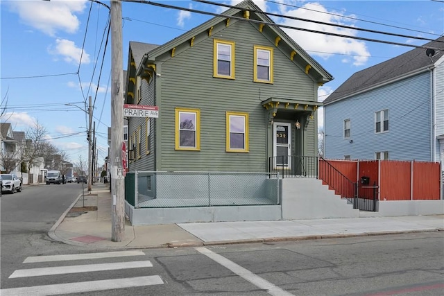 view of front of home featuring fence