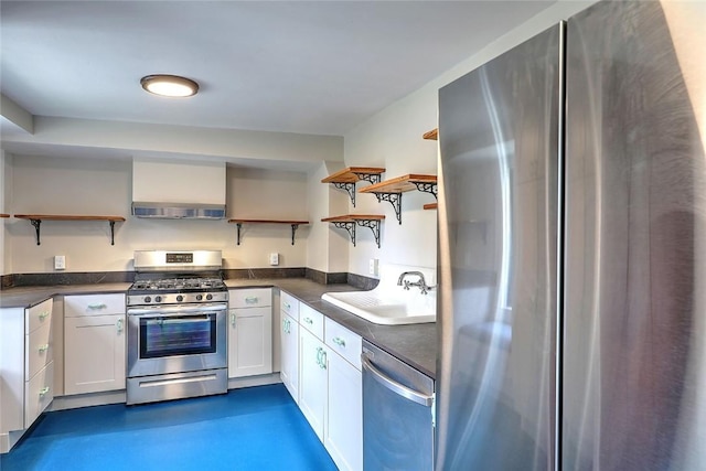 kitchen featuring dark countertops, a sink, stainless steel appliances, and open shelves