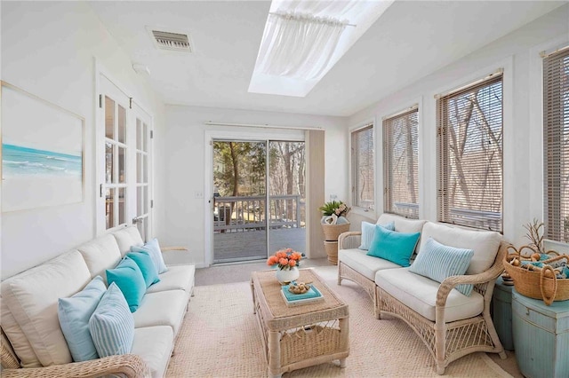 sunroom featuring a skylight and visible vents