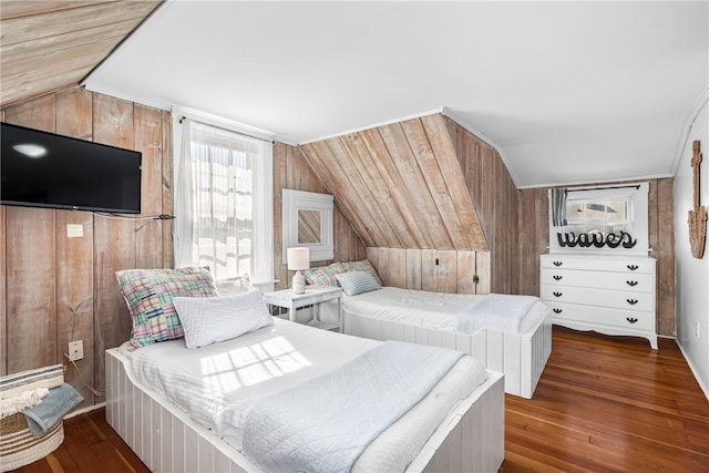 bedroom featuring lofted ceiling, wood-type flooring, and wooden walls