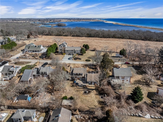 drone / aerial view with a water view and a residential view