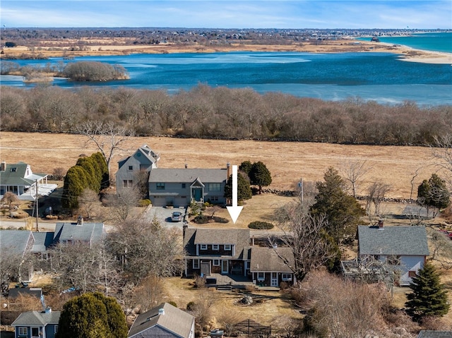 birds eye view of property featuring a water view