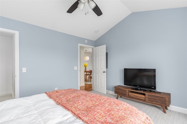 bedroom with carpet floors, ceiling fan, baseboards, and vaulted ceiling